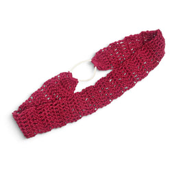 Handmade crochet headband in deep pink with open stitch pattern and white elastic band