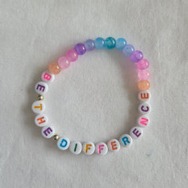 Colorful beaded bracelet with 'BE THE DIFFERENCE' message, handmade with vibrant beads