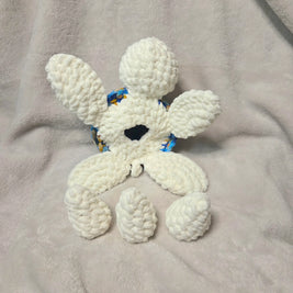 Handmade white crochet octopus with blue floral accents, cozy plush toy for comfort and creativity