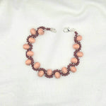 Handmade wooden bead bracelet with burgundy accents, cozy artisan jewelry for everyday wear