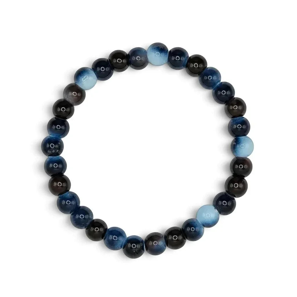 A beaded stretch bracelet made of round polished beads in shades of dark brown, black, and blue, arranged in a circle on a plain white background.