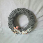 Handmade gray crochet wreath with dried flowers, cozy home decor