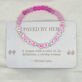 Pink and white beaded bracelet with 'LOVE MY VOICE' letter beads, displayed on a card with empowering quote.