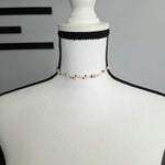Handmade beaded choker necklace with pearls and gold beads on mannequin, cozy crochet gift