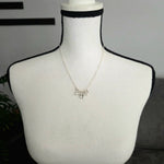 Delicate silver necklace with pearl charms on mannequin, handmade jewelry for everyday wear