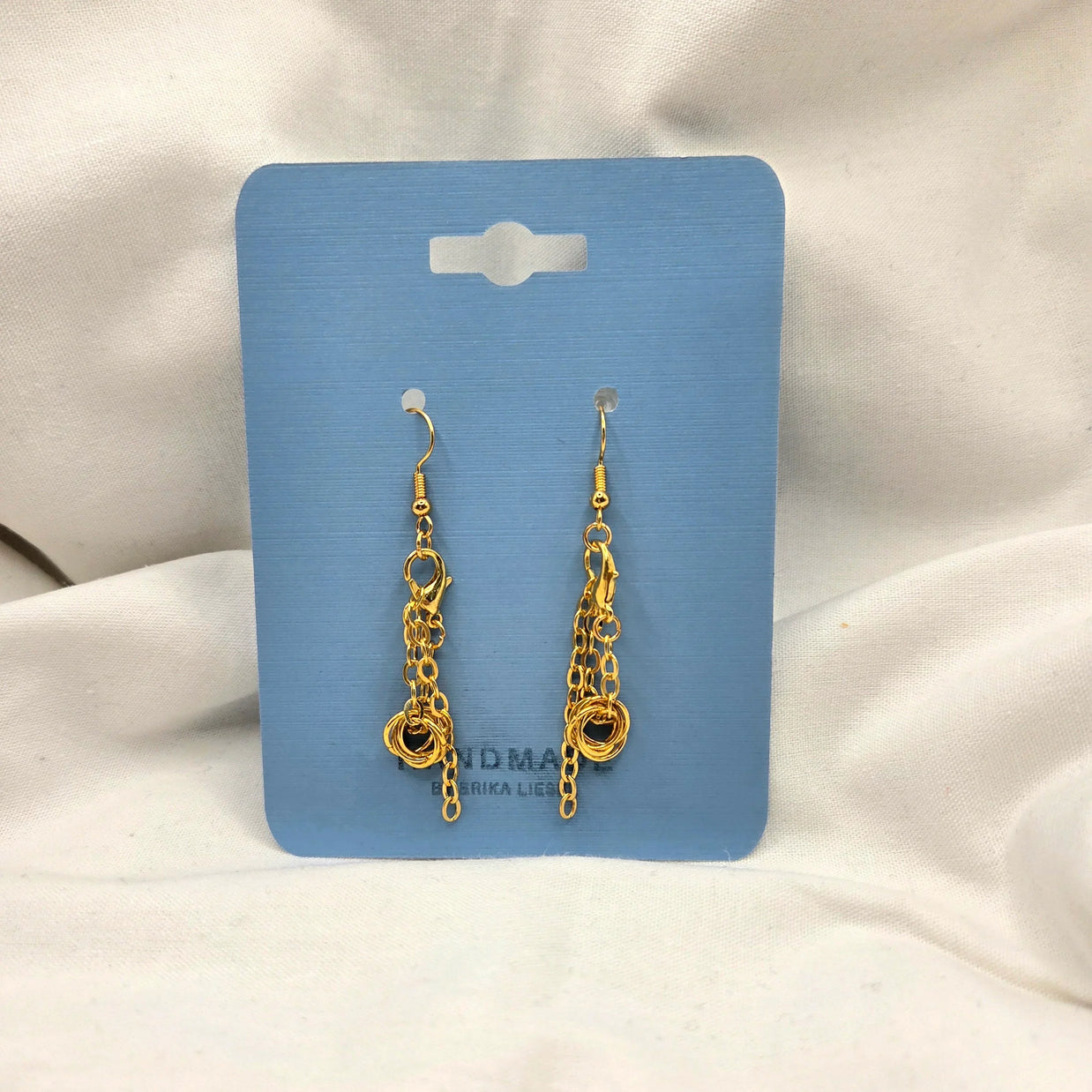 Gold chain link dangle earrings on blue display card, handmade jewelry gift