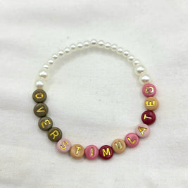 Overstimulated beaded bracelet with colorful letter beads and pearls, handmade for cozy everyday wear