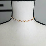 Handmade crochet choker necklace with amber beads on white mannequin, cozy boho style accessory