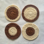 Handmade crochet coasters in brown and cream, cozy home decor for coffee or tea