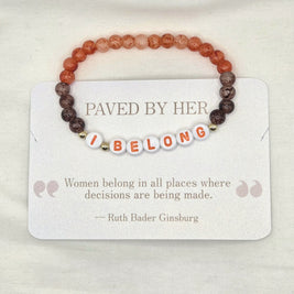 I BELONG beaded bracelet with orange and brown stones, displayed on a card with Ruth Bader Ginsburg quote.